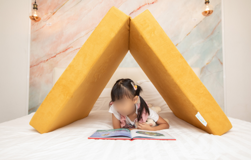 stackies (a malaysian modular play couch, modular kids play sofa in malaysia) in use as a simple tent for hideout and pretend play, a key to child development in Montessori growth